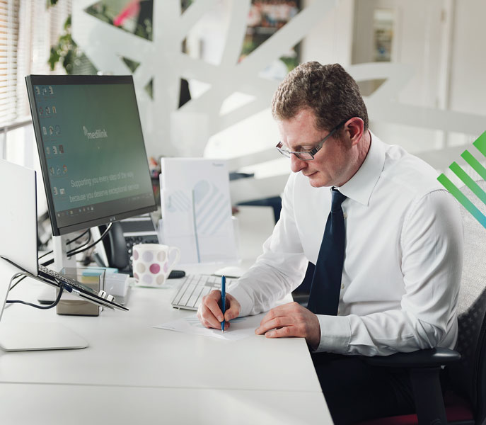 Man on the phone to Medilink Customer Services